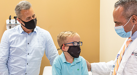 Nicholas with his father and doctor