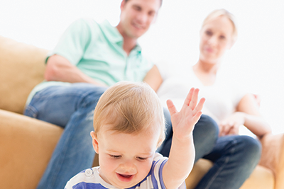 parents watching baby