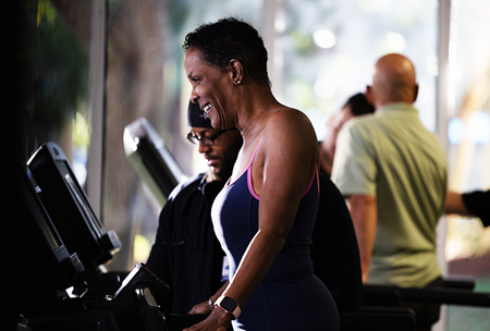 woman on treadmill with therapist