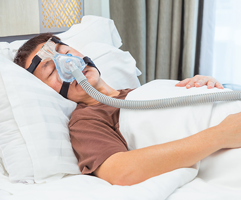 man sleeping with cpap